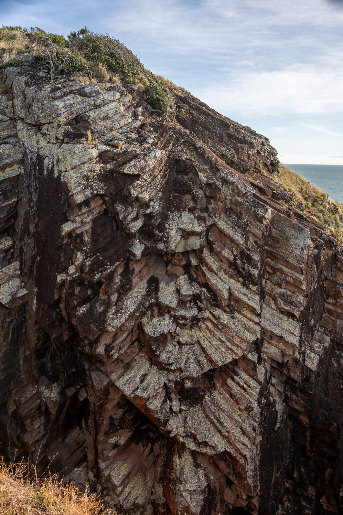 An interesting geological formation known as Fan Rock, has bars of rock fanning out from a central point